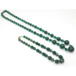 Two vintage bead necklaces, both with various green beads. The longest approx 32" long Please Note -