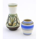 Two vases comprising a Poole Pottery vase with blue stripe detail, marked under Poole England, 113/