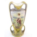 An Art Nouveau Royal Bonn vase with hand painted decoration depicting a woman at harvest in a