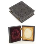 A Victorian daguerreotype / ambrotype hinged photograph case, with relief decoration depicting a