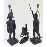 A pair of late 20thC table lamps modelled as soldiers of the Napoleonic wars, each standing 23 1/