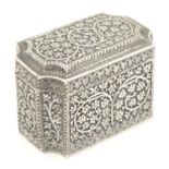 A white metal table box of shaped form with floral and scroll detail, possibly Indian. Approx. 2 1/