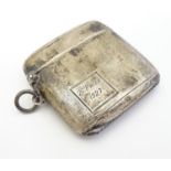 A silver vesta case with banded engine turned decoration, hallmarked Chester 1925, maker E J Trevitt