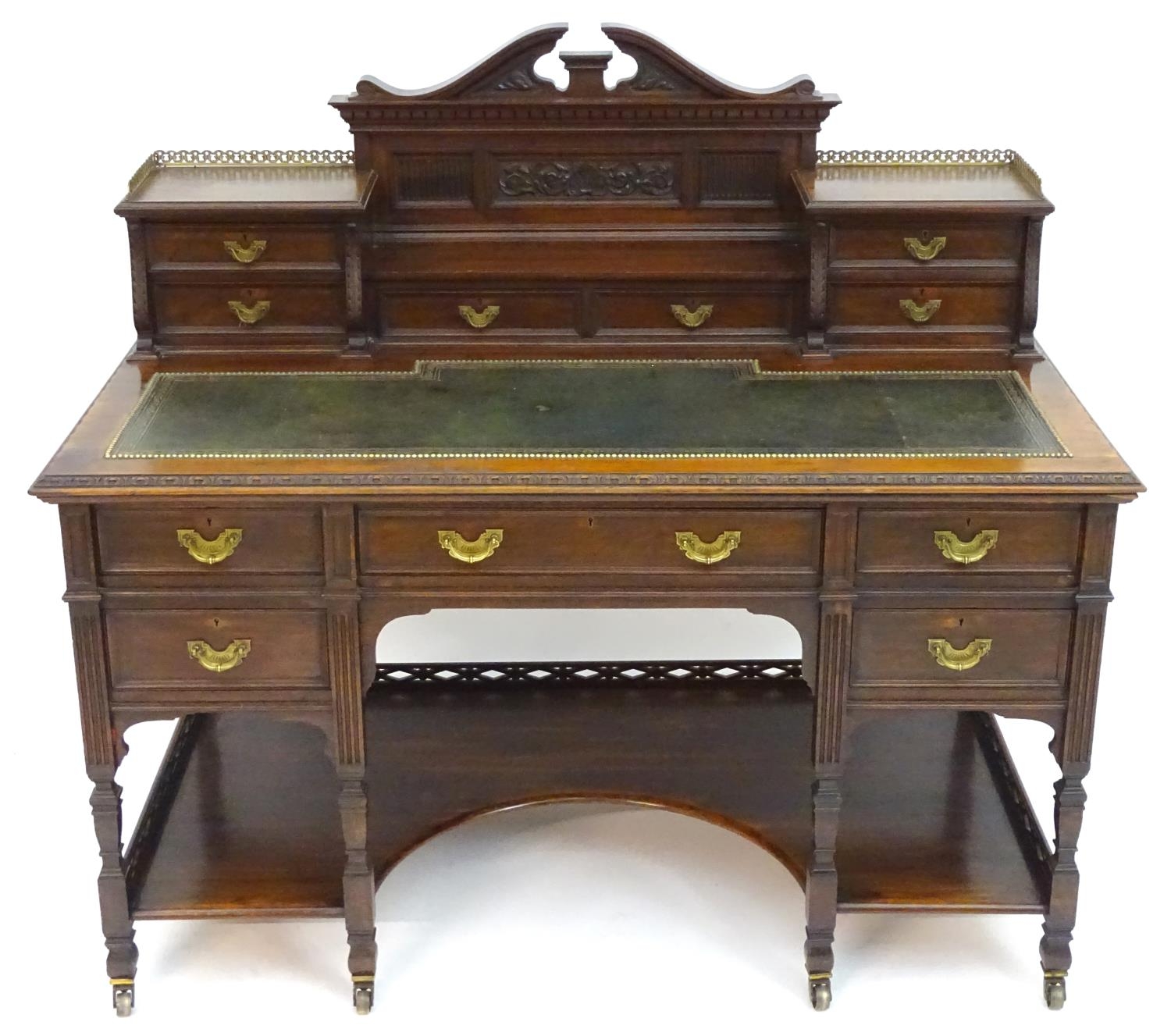 A late 19thC / early 20thC walnut Shoolbred desk with a carved back stand and a pierced brass - Image 3 of 13