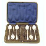 A cased set of 6 silver teaspoons with sugar tongs ensuite hallmarked Sheffield 1916 maker W S