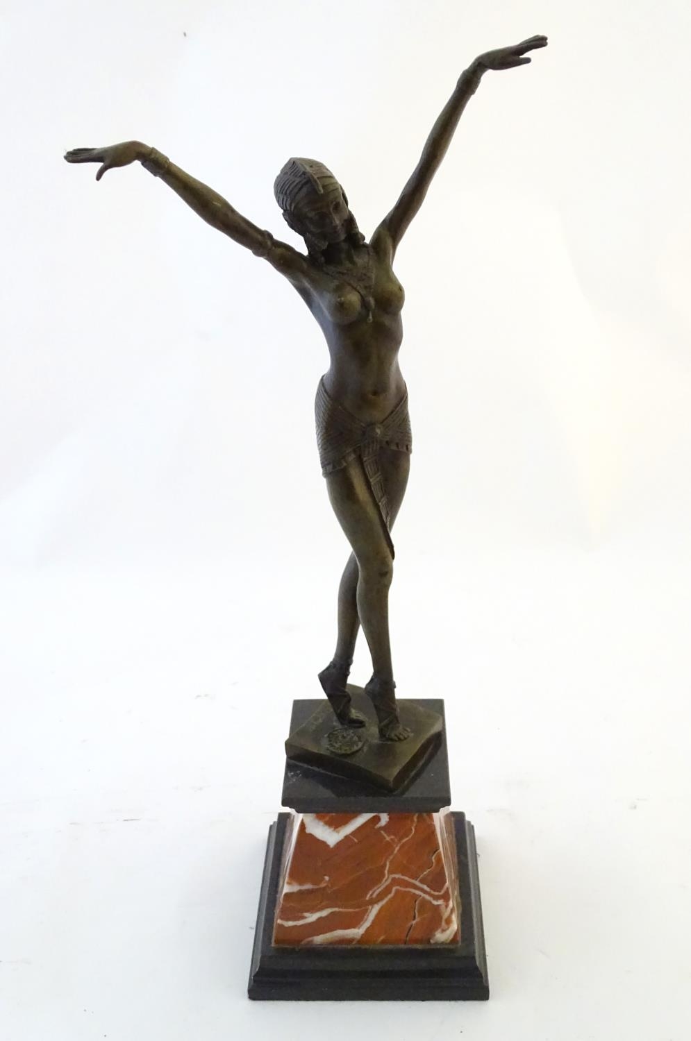 A 20thC French Art Deco style cast bronze model of a dancing exotic / Egyptian lady, after D.H.