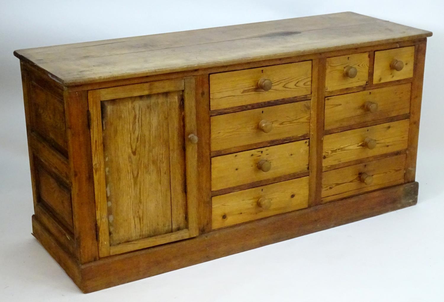 A late 19thC pine dresser base with a moulded rectangular top above a single cupboard, seven short - Image 6 of 7