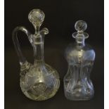 A 19thC pinched crystal decanter, the stopper with swirl decoration, together with a 19thC claret