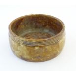 A Royal Doulton shallow planter / bowl with a mottled glaze, impressed floral motifs and banded rim.