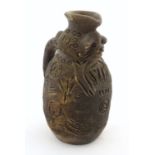 Ethnographic / Native / Tribal : An African pottery jug with animal / bear detail and incised
