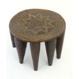 Ethnographic / Native / Tribal : An African carved hardwood stool with incised star and banded