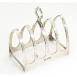 A silver five bar toast rack of arch form, hallmarked Sheffield 1934, maker Viner's Ltd. Approx.
