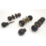 Four pairs of Victorian ebonised door knobs / handles / door furniture with brass mounts. Largest