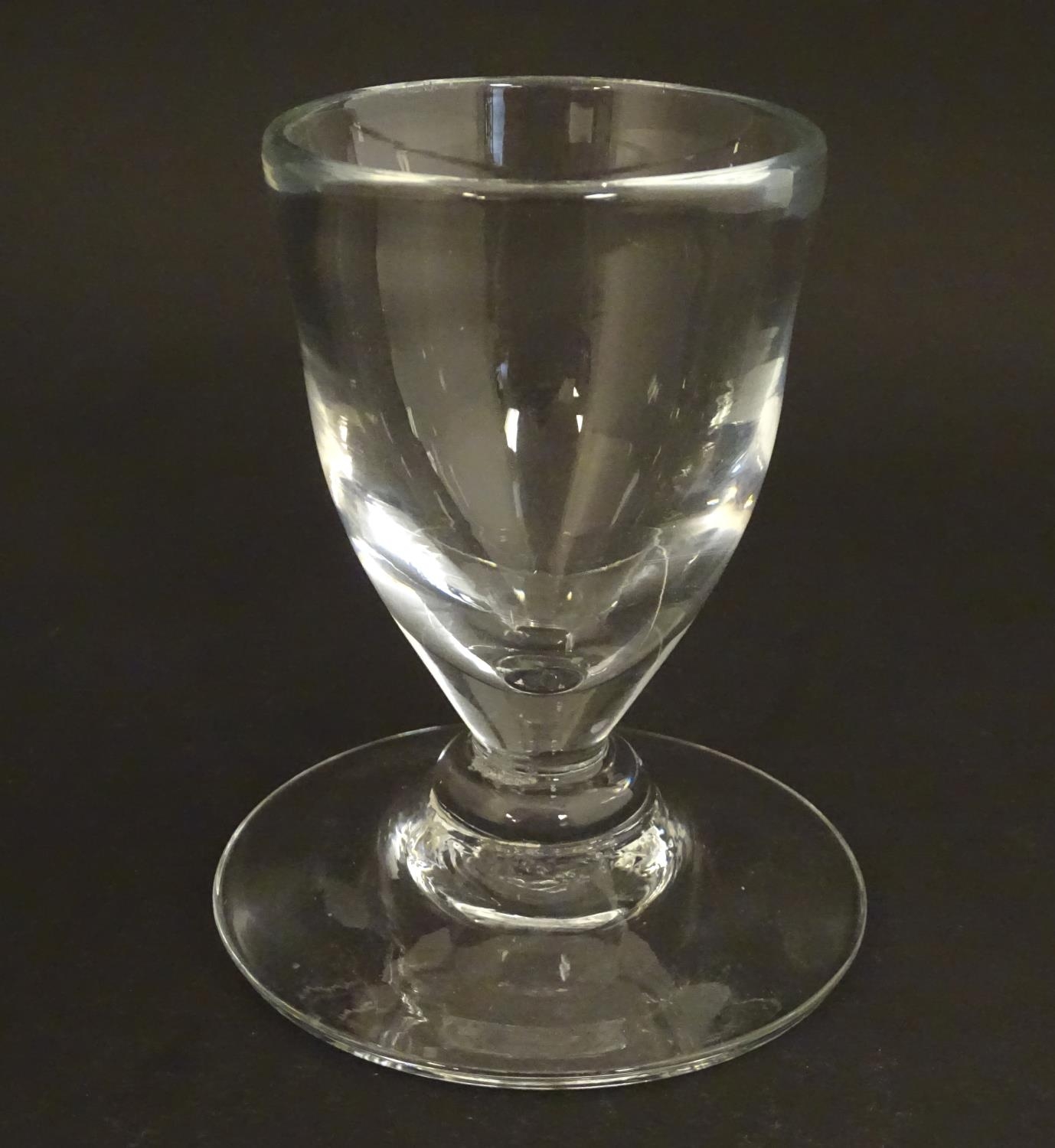 A drinking glass with wide foot. 4 1/2" high Please Note - we do not make reference to the condition - Image 3 of 5