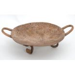 A Scandinavian / Danish Arts & Crafts style twin handled copper dish with hammered decoration and