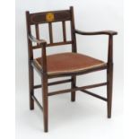 An early 20thC mahogany elbow chair from the Catherine Cookson collection, Originally auctioned at