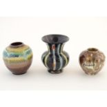 Three West German vases comprising a squat vase with a banded drip glaze, marked 701/9, a squat vase