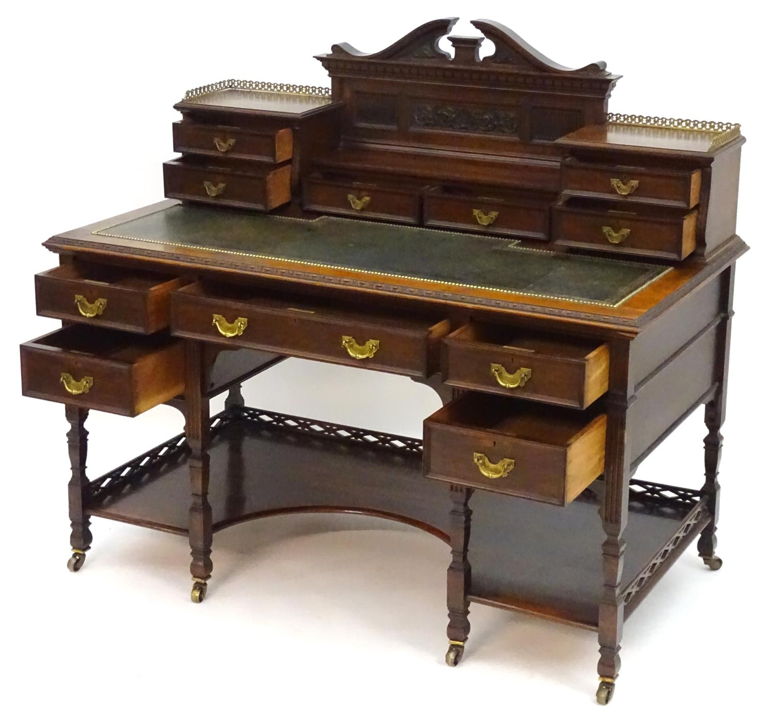 A late 19thC / early 20thC walnut Shoolbred desk with a carved back stand and a pierced brass - Image 6 of 13