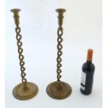 A pair of Victorian brass candlesticks with open twist columns. Approx. 20 1/4" high (2) Please Note