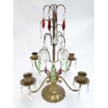 A 20thC brass candelabra / candelabrum with four branches and cups, decorated with red, green,