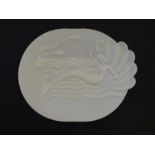 A white Art Deco Bakelite plate with mermaid decoration, the underside marked 'British made , modern