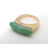 A 14ct gold jade saddle ring. marked 585 14k. Ring size approx J Please Note - we do not make