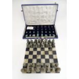Toys: A carved stone set of chess pieces by Kohinoor Jewellers, an onyx and granite chessboard,