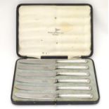 A set of six silver handled tea knives hallmarked Sheffield 1918 maker Walker and Hall. each