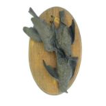 A 20thC Continental cast sculpture of three dead birds, possibly ortolan / lark birds in the