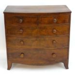 A mid 19thC mahogany chest of drawers with a bow front above two short over three long graduated