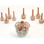 A quantity of Japanese Kutani vases, comprising 12 bottle vases with floral and bird detail, and a