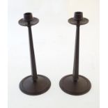 A pair of Art Deco Bakelite candlesticks of tapering form with circular base. Produced by Linsden