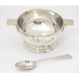 A silver twin handed bowl / porringer hallmarked Sheffield 1925 together with spoon hallmarked