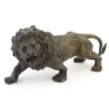A 19thC cast bronze model of a prowling lion, signed 'Rodin' to back leg. Approx. 12" long Please