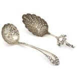 Two silver sifter / strainer spoons, one hallmarked Birmingham 1899, maker Levi & Salaman, the other
