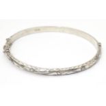 A silver bracelet of bangle form, hallmarked Birmingham 1988 Please Note - we do not make