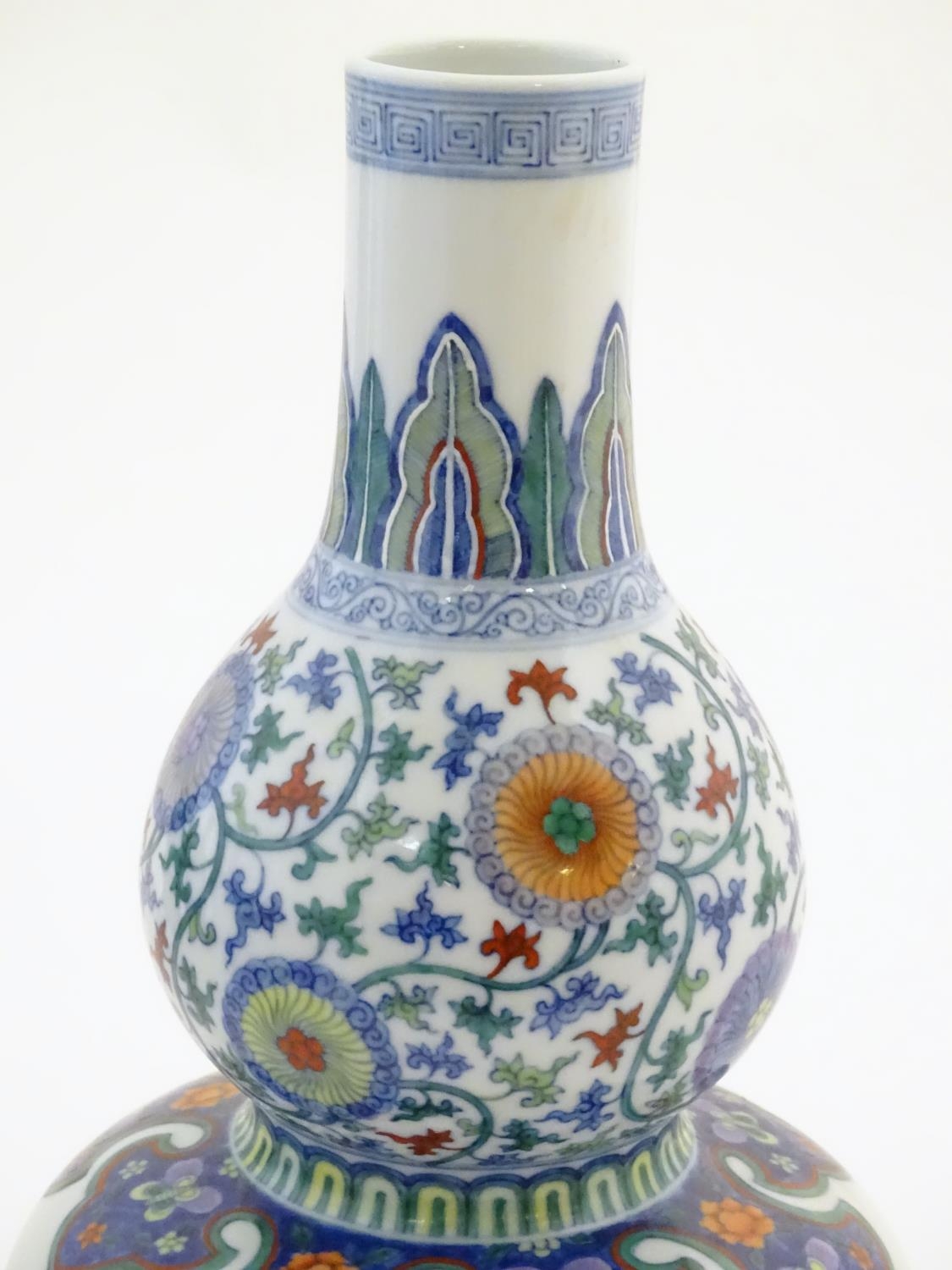 A Chinese double gourd vase with doucai style decoration with scrolling floral and foliate detail. - Image 12 of 16