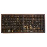 A vintage letterpress tray / drawer with a quantity of assorted carved wooden letter, number and