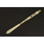 A Victorian bone letter opener / pen / stanhope with carved and pierced detail, the stanhope