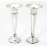 A pair of silver bud vases hallmarked Birmingham 1974, maker A. T Canon Ltd. Approx. 4 1/2" high (2)