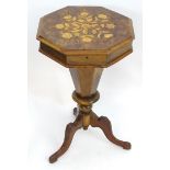 A late 19thC trumpet shaped sewing table with floral satinwood inlay and a burr walnut top, a canted