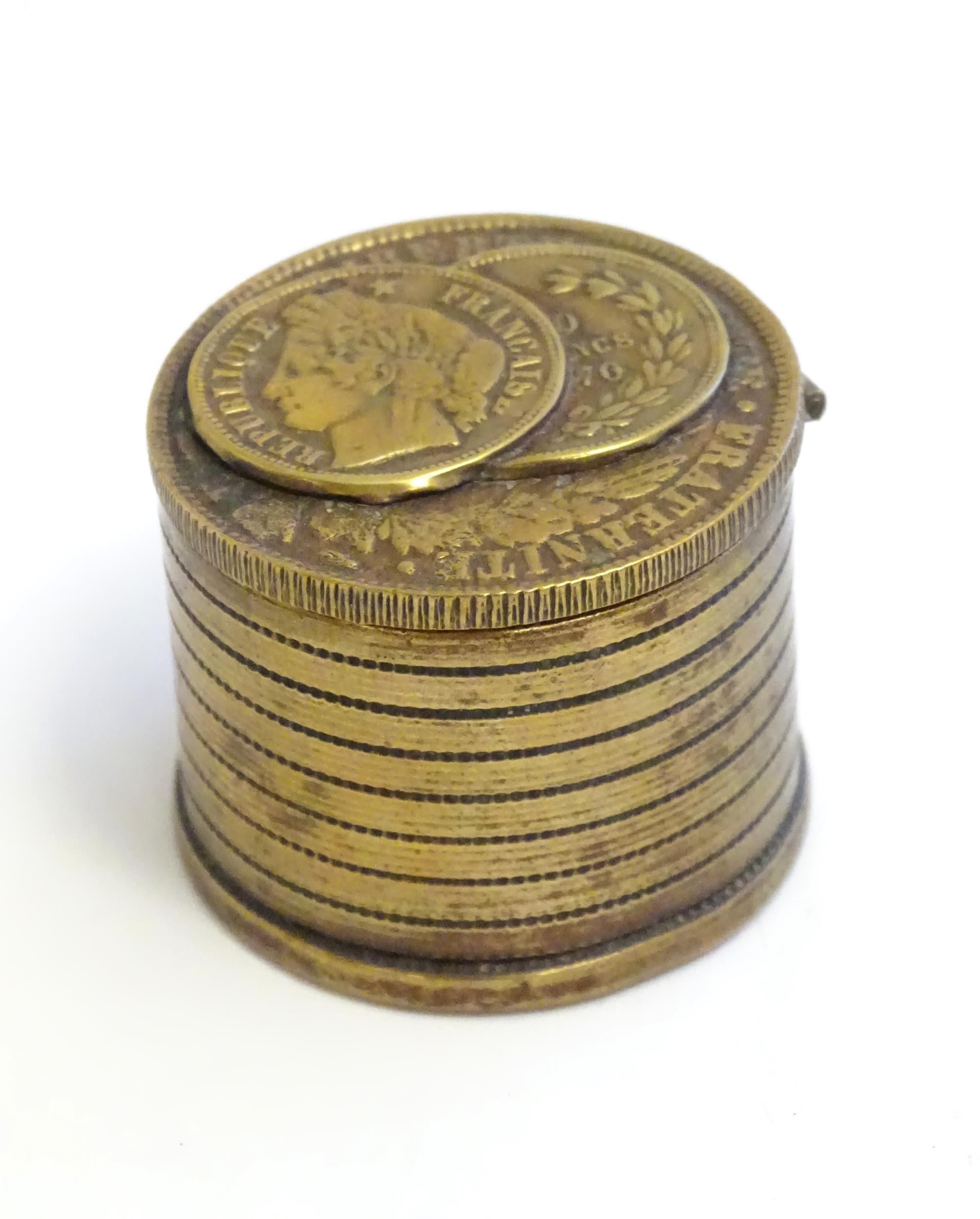A 20thC Continental cast inkwell modelled as stacked coins, with applied French coins to top. - Image 4 of 9