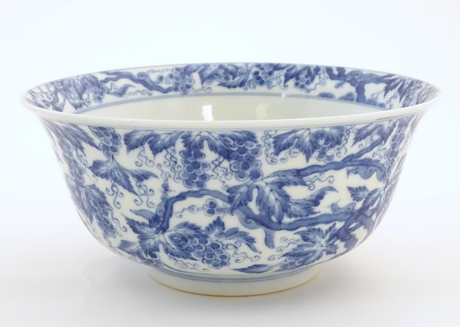 A Chinese blue and white bowl decorated with vine leaves and grapes. Character marks under. - Image 4 of 9