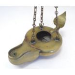 A 19thC brass hanging oil lamp formed as a large oversized 'genie' lantern. Approx. 13 1/2" long