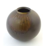 A Japanese vase of globular form with a drip glaze. Approx. 10 3/4" high Please Note - we do not