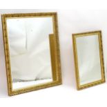 Two modern mirrors with gilt surrounds and bevelled centres. The largest 52" wide x 40" high. Please