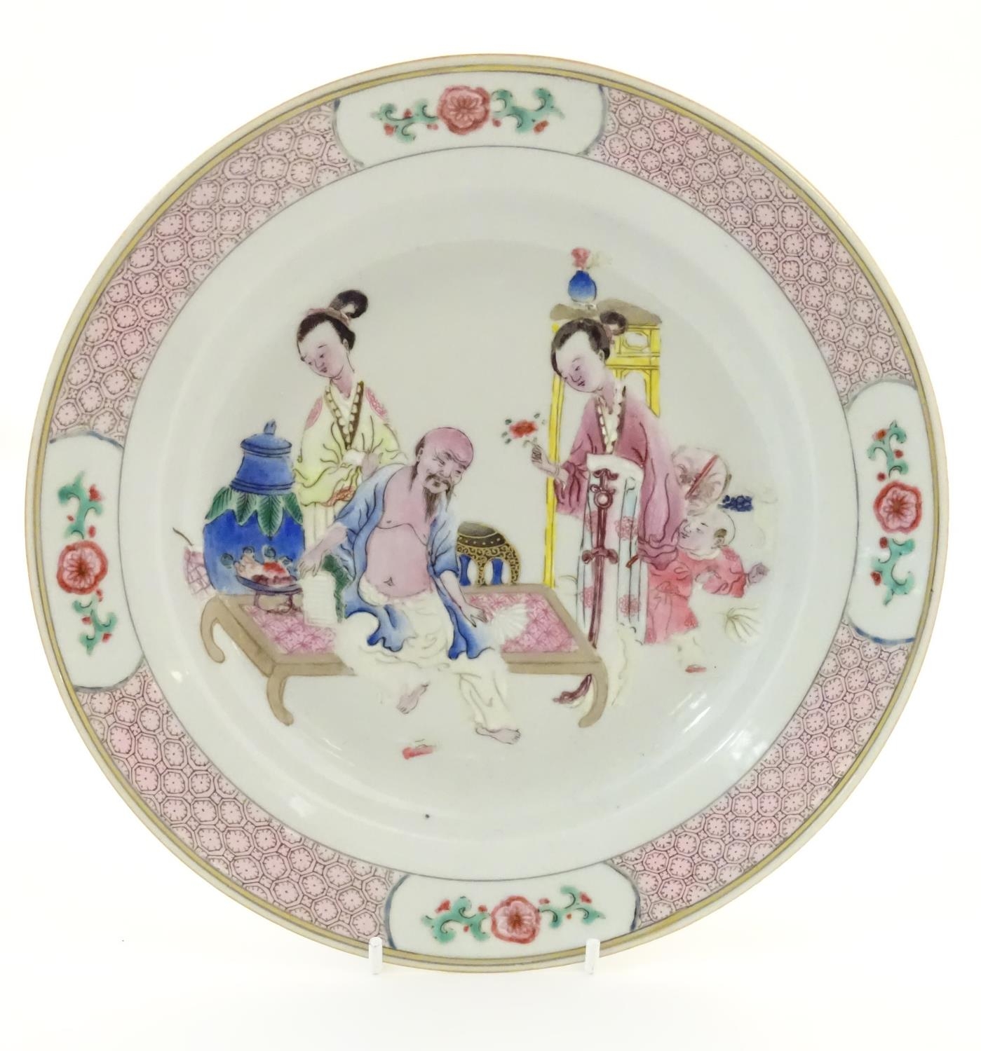 A Chinese famille rose plate decorated with an interior scene with an elderly scholar on a day bed - Image 3 of 5