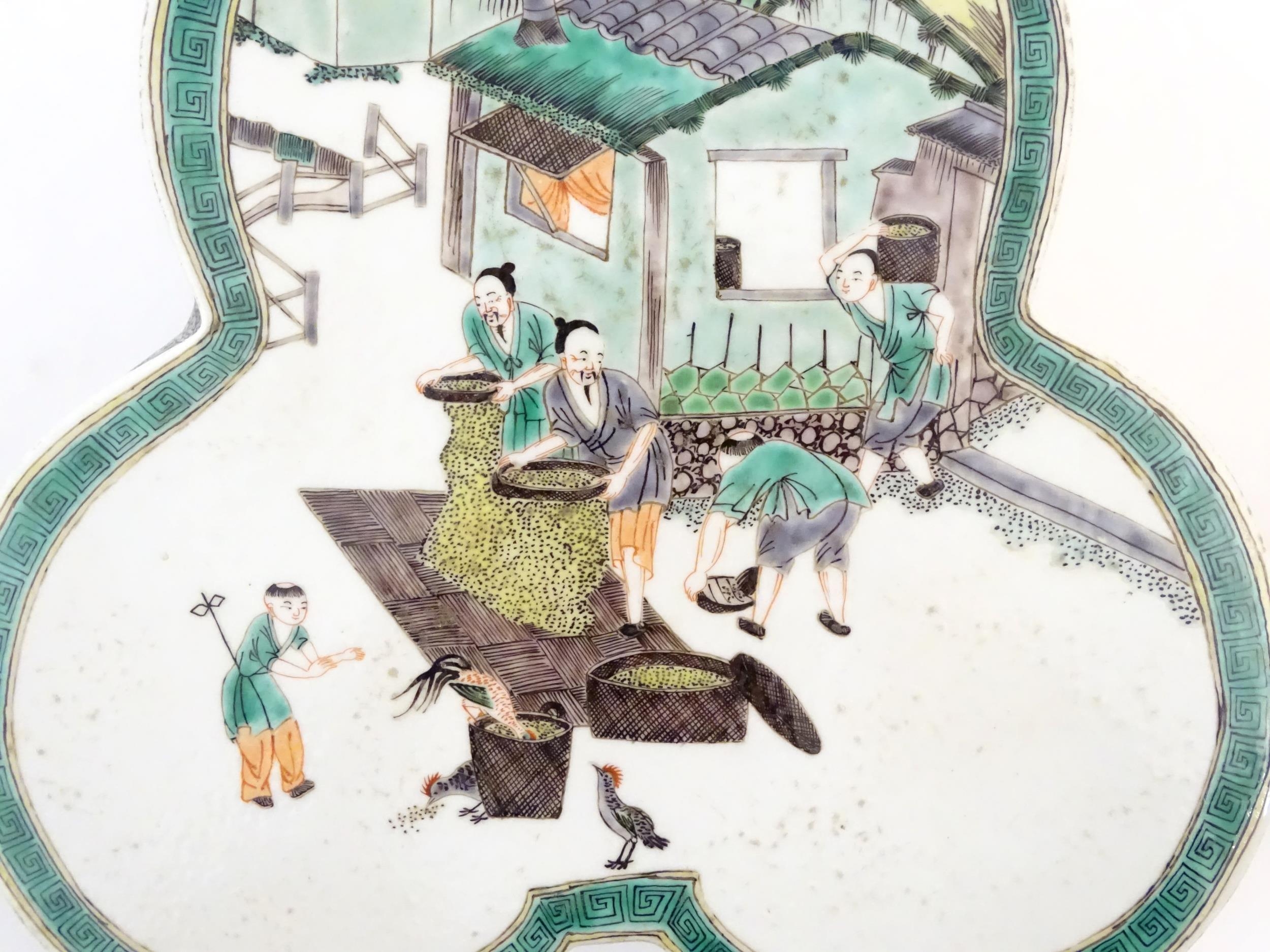 A Chinese famille verte stand of trefoil form depicting figures sifting grain and shooing - Image 5 of 9