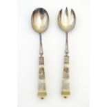 A pair of late Victorian silver plated salad servers by William Hutton & Sons, the ceramic handles