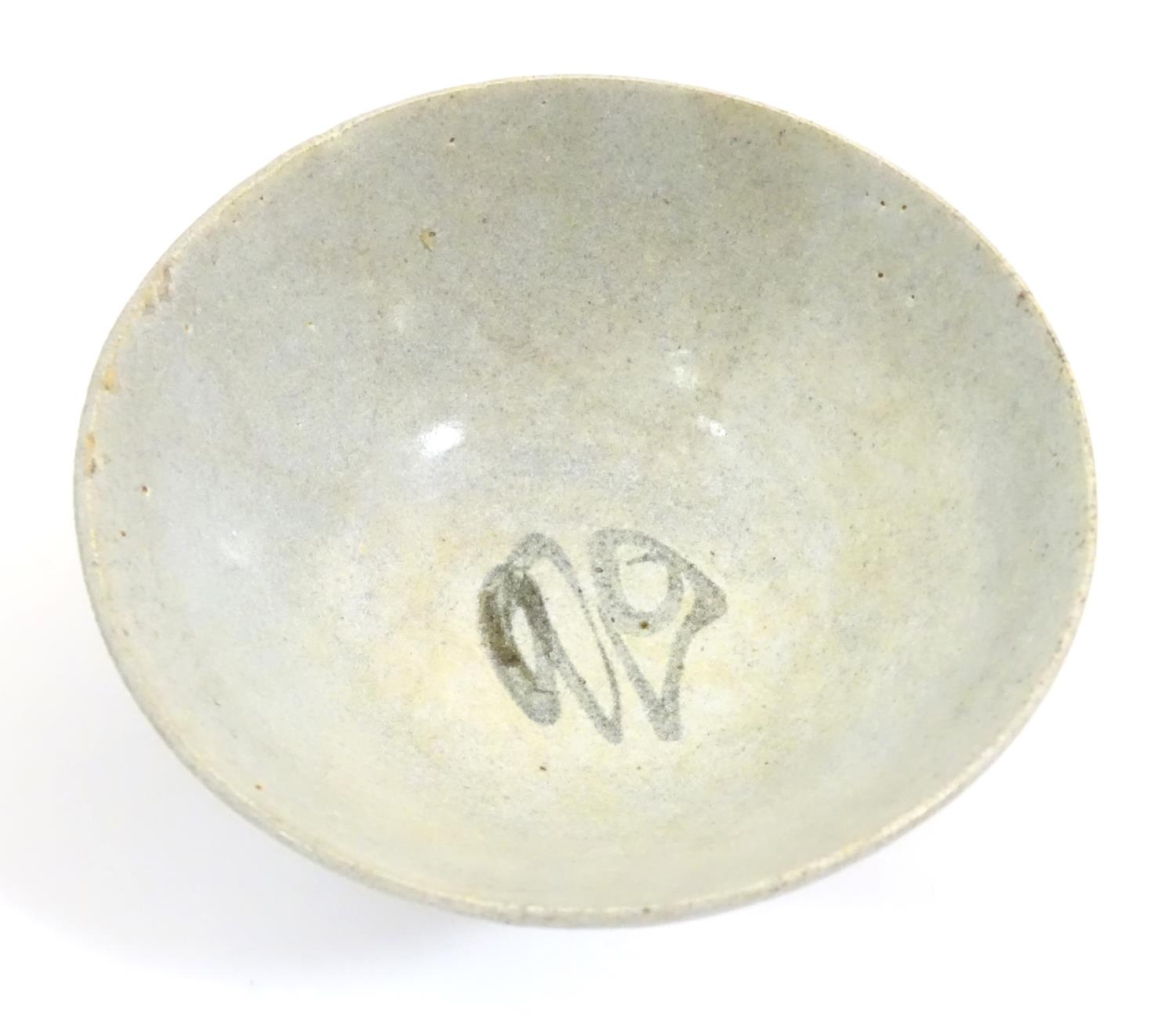 An Oriental earthenware bowl of tapering form with brushwork detail. Approx. 2 1/4" high x 5" - Image 4 of 7